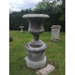 Garden pots/planters: A composition stone urn on pedestal, 156cm high