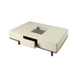 Furniture: An unusual white leather mounted coffee table, modern, with three drawers one fitted with