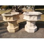 Garden urns/pots: A pair of Gothic-style octagonal composition stone planters on stands, modern,
