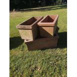 Garden pots/urns: A similar set of four rectangular terracotta planters