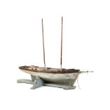 Marine: An unusual pond yacht lugger , late 19th century , on later wooden stand, 194cm high by