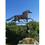 Weathervanes: A copper weathervane, late 19th/early 20th century, on associated stone base, 86cm