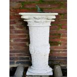 Sundials: A Romanesque style composition stone sundial with bronze plate, 115cm high overall