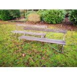 Garden seats: A pair of wrought iron and wooden slatted seats, circa 1900, 183cm long