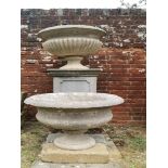 Garden pots/planters: Two carved limestone urns, mid 19th century , the larger 70cm diameter