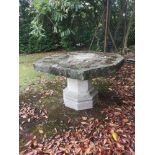 Garden tables/furniture: A composition stone table, 124cm wide