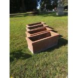 Garden pots/urns: A similar set of four rectangular terracotta planters