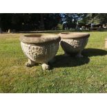 Garden pots/urns: A pair of composition stone circular planters on paw feet, 2nd half 20th