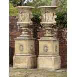 Garden pots/planters: A pair of substantial composition stone urns on pedestals, modern, 292cm high.