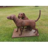 Sculpture: A cast iron group of two dogs modern 70cm high by 87cm long