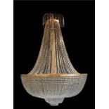 Lighting: A cut glass and gilt metal chandelier 1970s 230cm high by 150cm diameter