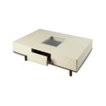 Interior Design/Furniture: An unusual white leather mounted coffee table modern with three drawers