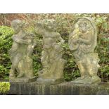Garden Statuary: A set of three composition stone putti representing Spring, Autumn and Winter