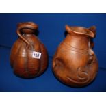 Pair of Spanish sculpted water jugs - signed 'Ortega'