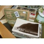 Box of cigarette cards and topographical postcards
