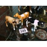 Trio of miniature Beswick calves