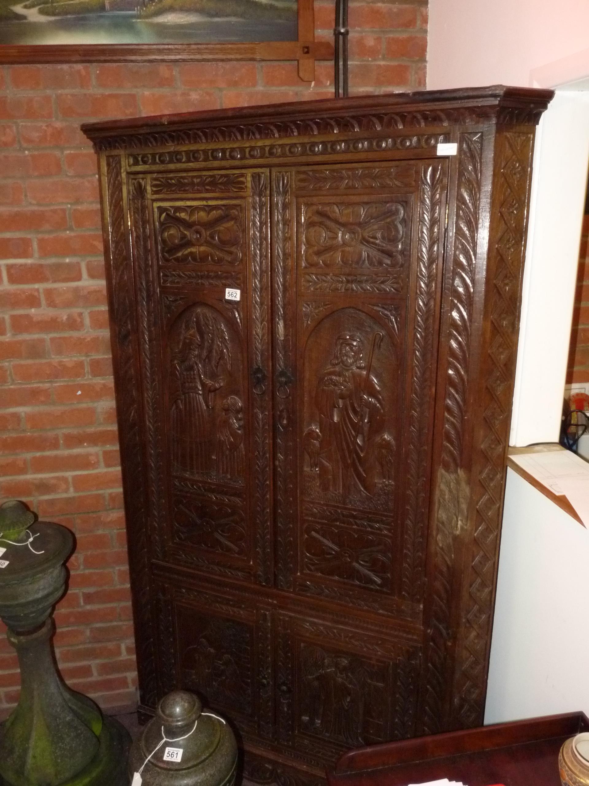 Carved antique oak corner cupboard