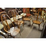 4 x Ercol swan armchairs