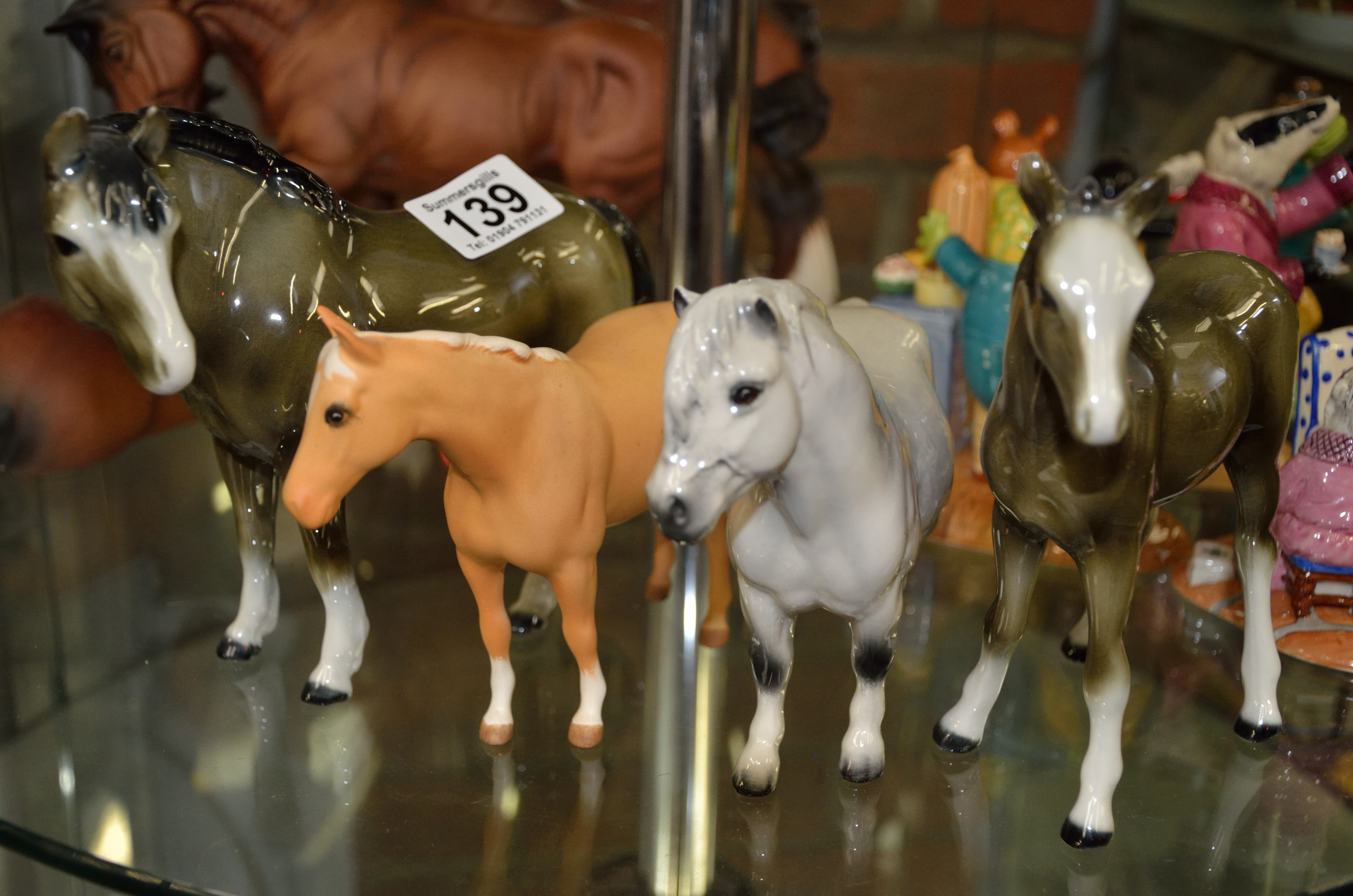 Set of four Beswick gloss horses incl Palomino and grey