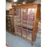 Mahogany bookcase with ball and claw fee & table