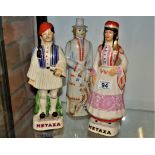 Group of three Greek Metaxa Porcelain bottles