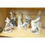 Group of five Nao porcelain clowns, jesters and children