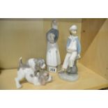 Group of four Lladro figures and puppies