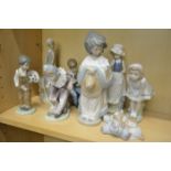 Group of eight Nao porcelain figures