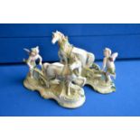 Pair of continental porcelain horse and cart figures