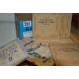 Box of stamp albums and cigarette cards