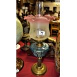 Antique turquoise and pink rimmed brass oil lamp