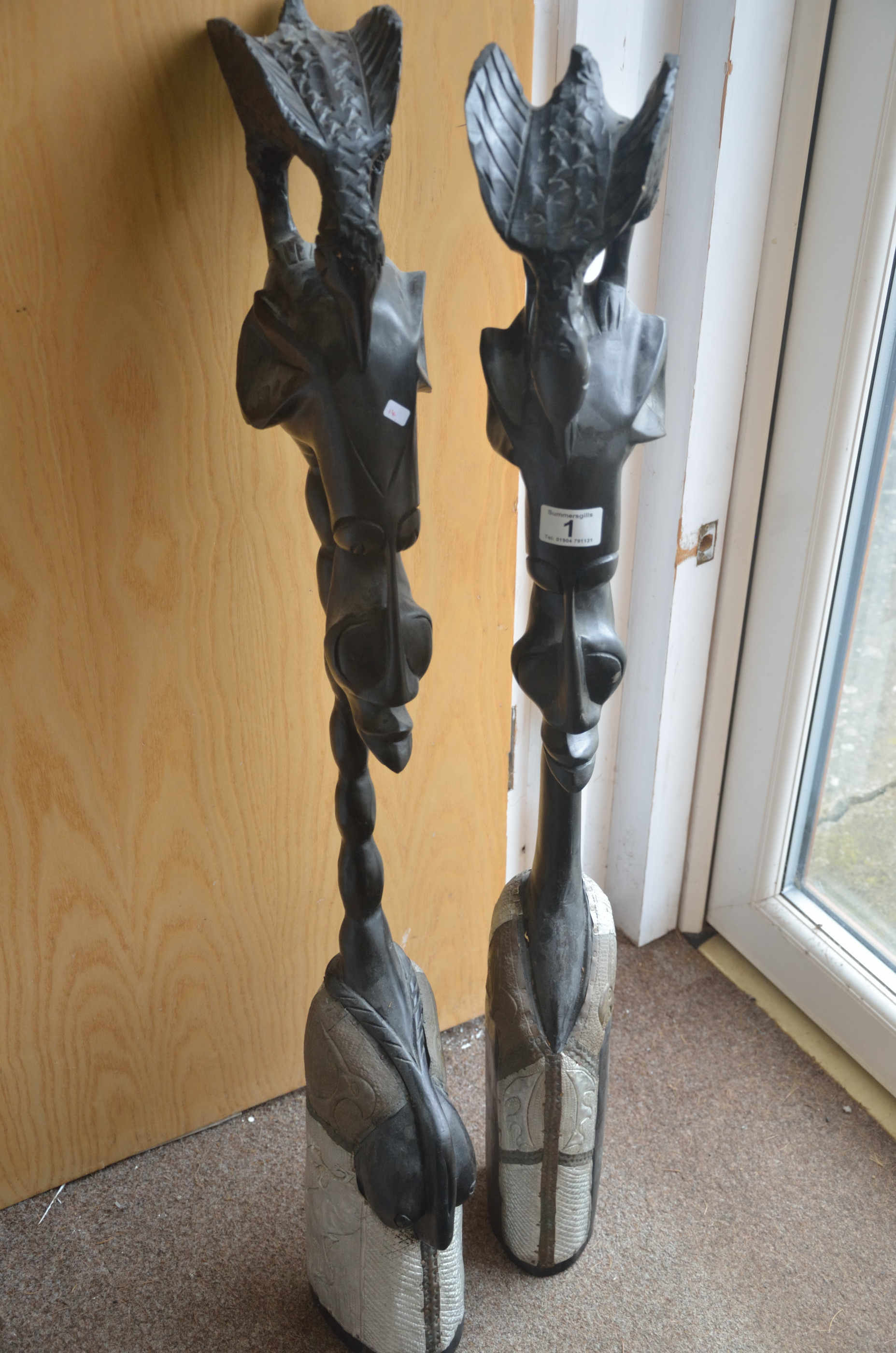 Pair of Wooden and metallic sankofa male and female floor figures standing 1m high