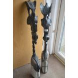 Pair of Wooden and metallic sankofa male and female floor figures standing 1m high