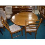 Ercol extending circular dining table and 4 ladder back chairs