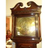 Oak Grandfather clock with brass face by James Butler, Bolton