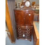 Repor. Mahogany drinks cupboard and mantle clock