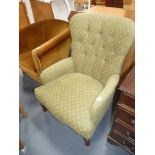 Green upholstered armchair