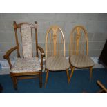 2 Ercol dining chairs with swan decoration and armchair