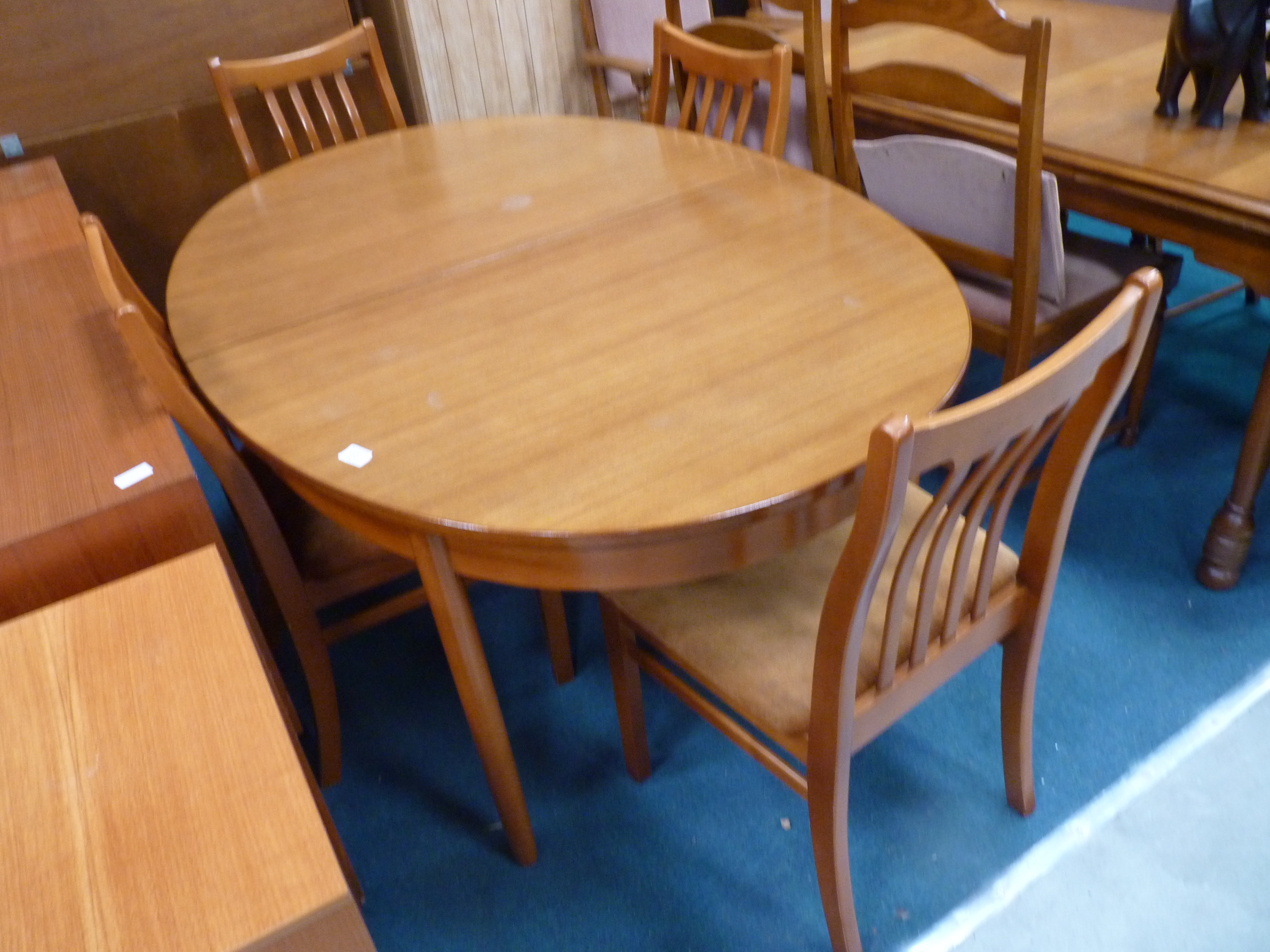 Extending teak dining table and 4 chairs