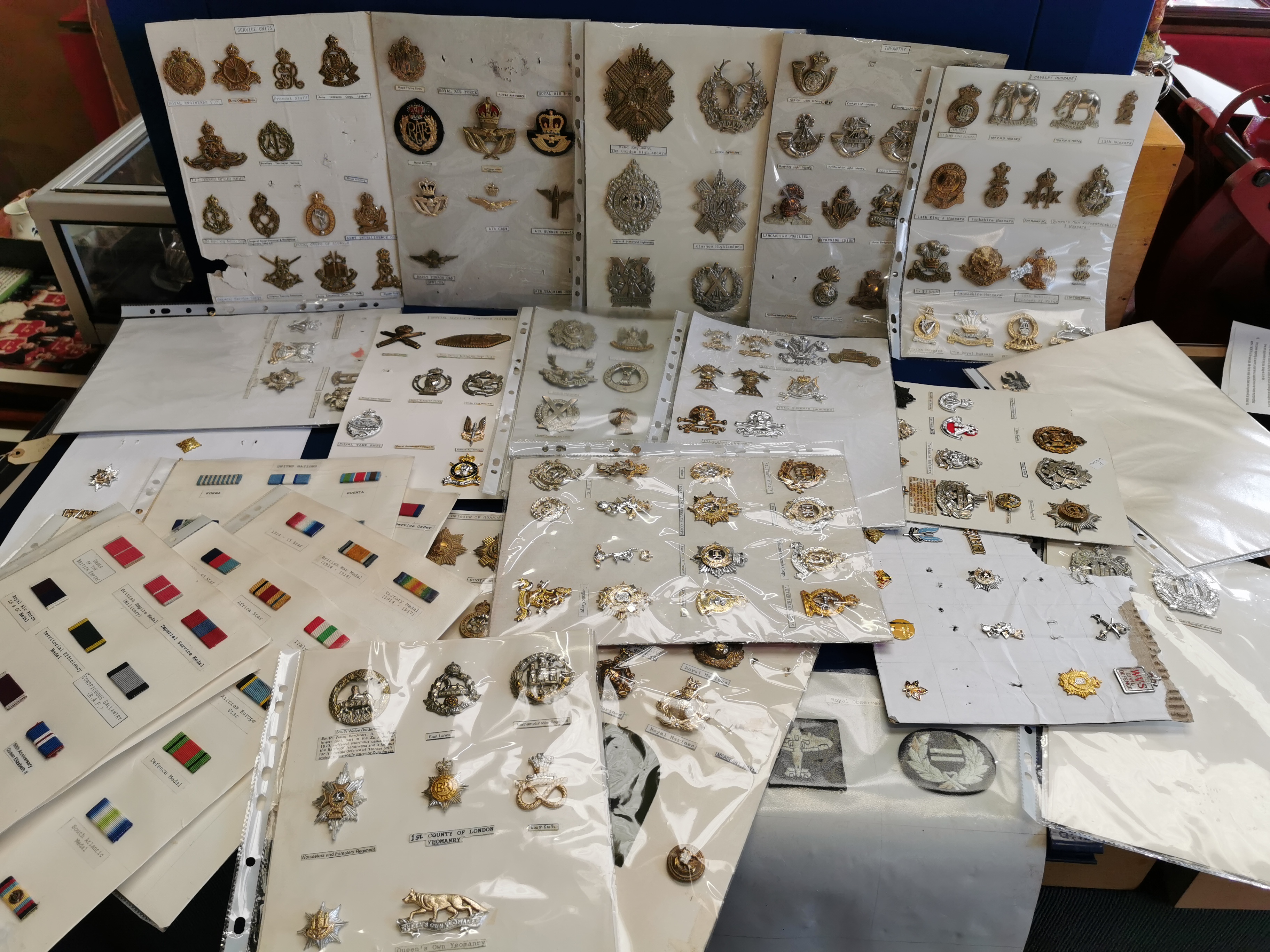 Collection of Mounted Military Cap Badges from UK Regiments/Infantry Corps