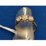 Three Stone Diamond Ring w/a 1/4ct Claw Set Diamond, flanked by two smaller stones