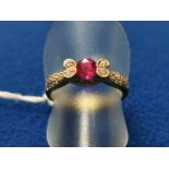 Ruby & Diamond Cocktail Ring, featuring a Starburst Claw Set with a Centre Ruby surrounded by