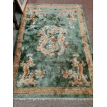 Oriental green rug with Chinese dragon detail 184cm x 124cm