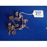 9ct gold charm bracelet with marked charms 28g