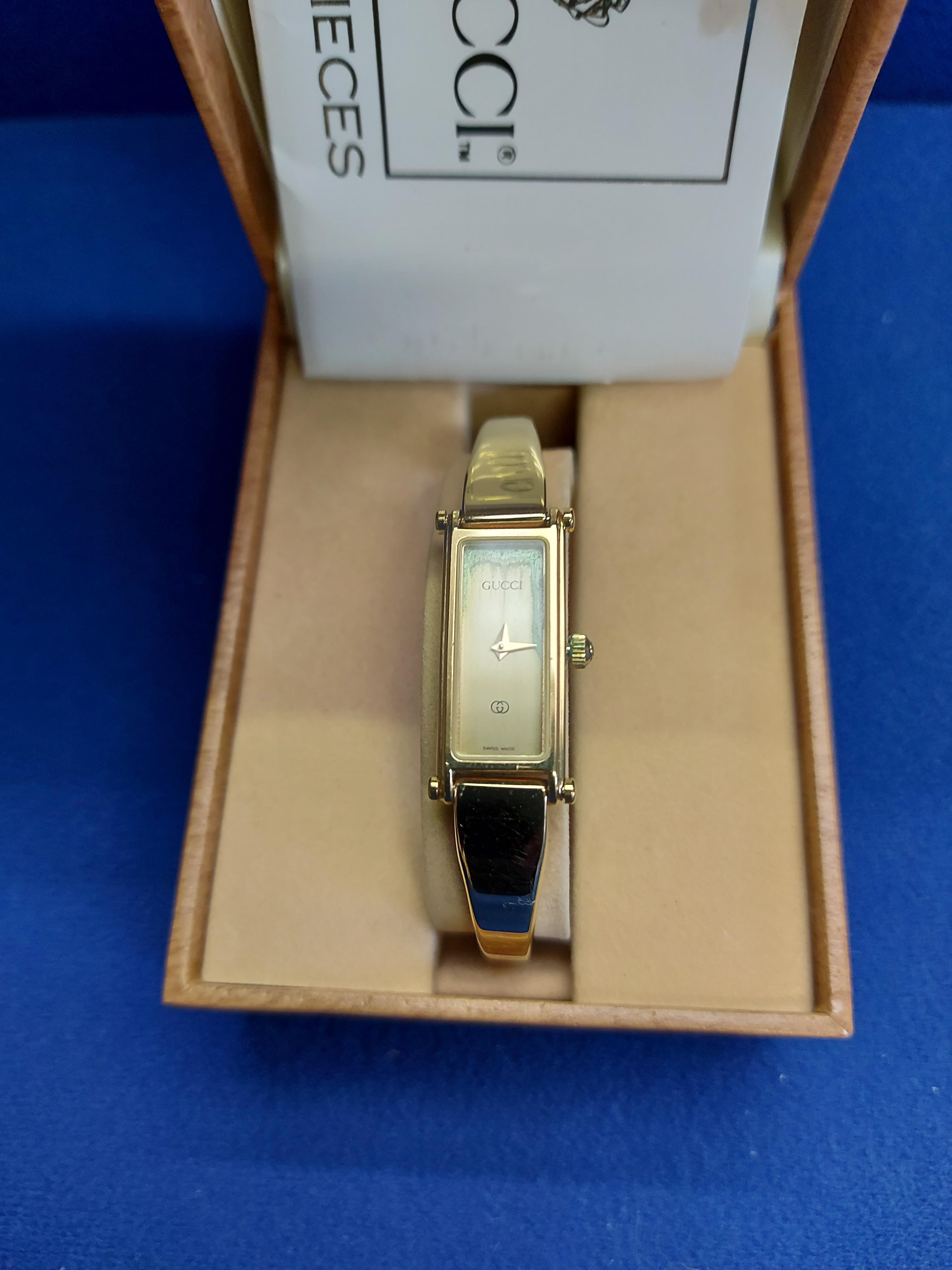 Ladies Gucci wristwatch marked on rear 1500 and with matching paperwork