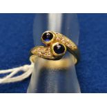 Diamond & Sapphire Snake Dress Ring featuring two cabochon stones w/diamond dressings, band