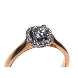 AN 18CT ROSE GOLD AND ROUND BRILLIANT CUT DIAMOND HALO RING Complete with IGI certificate (size I/