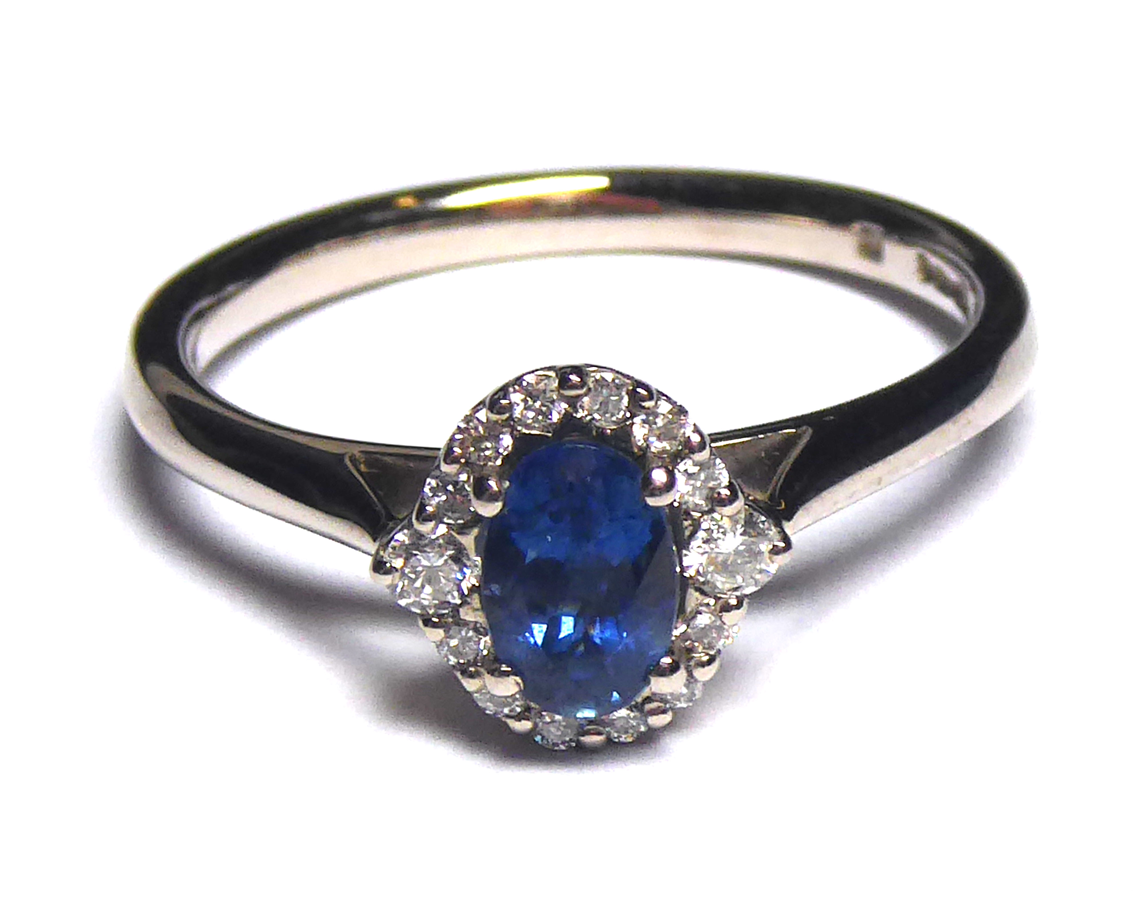 AN 18CT GOLD, SAPPHIRE AND ETHICAL DIAMOND RING Having an oval cut stone edged with diamonds (size - Image 2 of 2