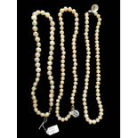 TWO PEARL NECKLACES Single row of pearls with a silver clasps. (approx 20cm)
