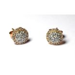 A PAIR OF 18CT GOLD AND DIAMOND STUD EARRINGS Pave set diamonds in a spherical design. (approx 0.